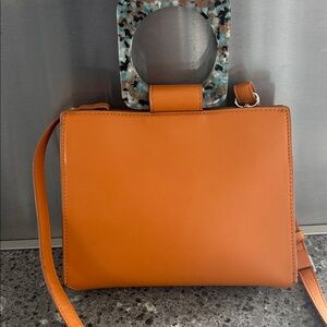 Orange Handbag with Unique Handle